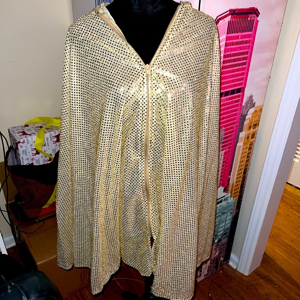 Custom made gold zip up cape.